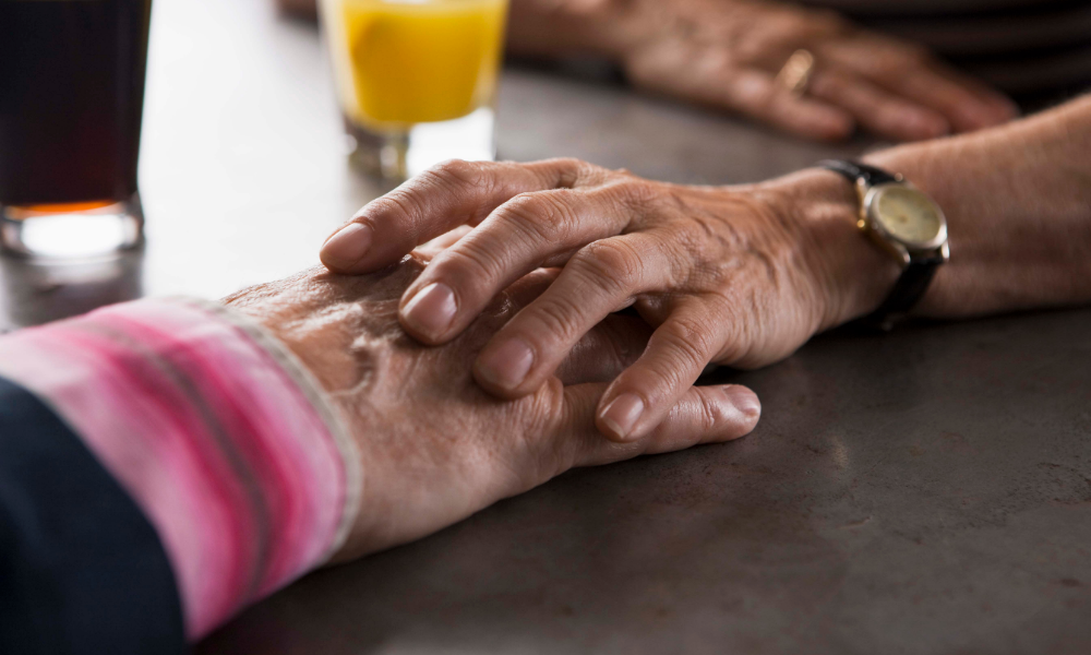 Melisa Wells and Husband holding hands